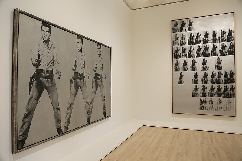 
              Silkscreen pieces by Andy Warhol showing Elvis Presley and Elizabeth Taylor are seen during a preview of the newly expanded San Francisco Museum of Modern Art Thursday, April 28, 2016, in San Francisco. The new museum opened to the public Saturday, May 14, 2016 with 19 inaugural exhibitions showcasing the work of artists like Diego Rivera, Henri Matisse, Andy Warhol and Mark Bradford.
 (AP Photo/Eric Risberg)
            