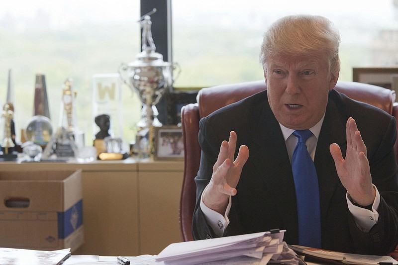 In this Tuesday, May 10, 2016 file photo, Republican presidential candidate Donald Trump gestures as he speaks during an interview with The Associated Press in his office at Trump Tower, in New York. The billionaire presidential candidate who prides himself on paying his own way and bashed his competitors for their reliance on political donors now wants their money - and lots of it. Trump, the presumptive Republican presidential nominee, recently hired a national finance chairman, scheduled his first fundraiser and is on the cusp of signing a deal with the Republican Party that would enable him to solicit donations of more than $300,000 apiece from supporters. (AP Photo/Mary Altaffer, File)