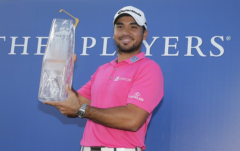 
              Jason Day of Australia, holds The Players Championship trophy Sunday, May 15, 2016, in Ponte Vedra Beach, Fla. (AP Photo/Lynne Sladky)
            