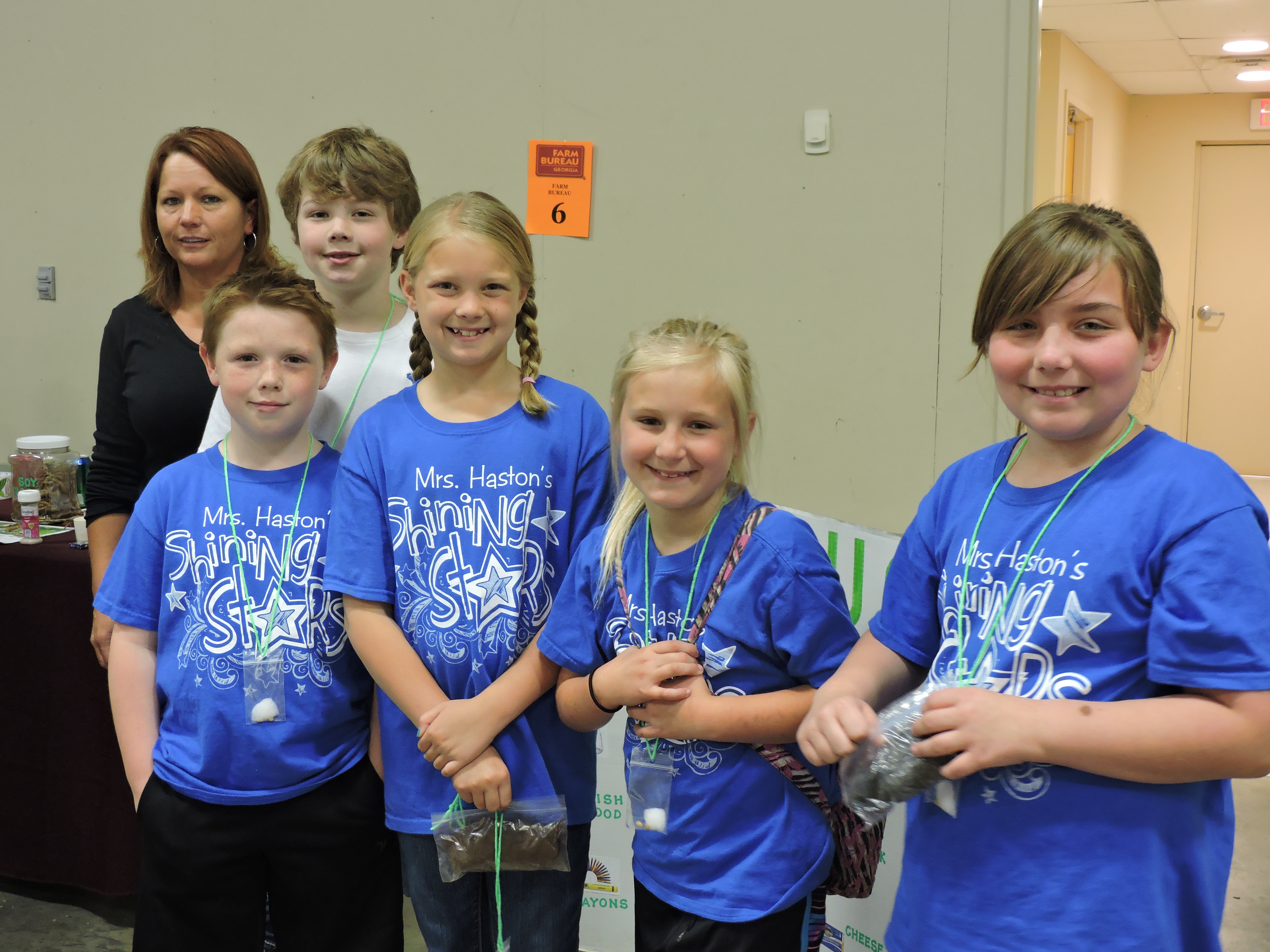 Farm Bureau Chair of the Women's Committee Sonia Butler works with Cherokee Ridge Elementary's Mason Krech, Blake Price, Maria Ronda and Riley Spainhower, from left. The students learned about soybeans.