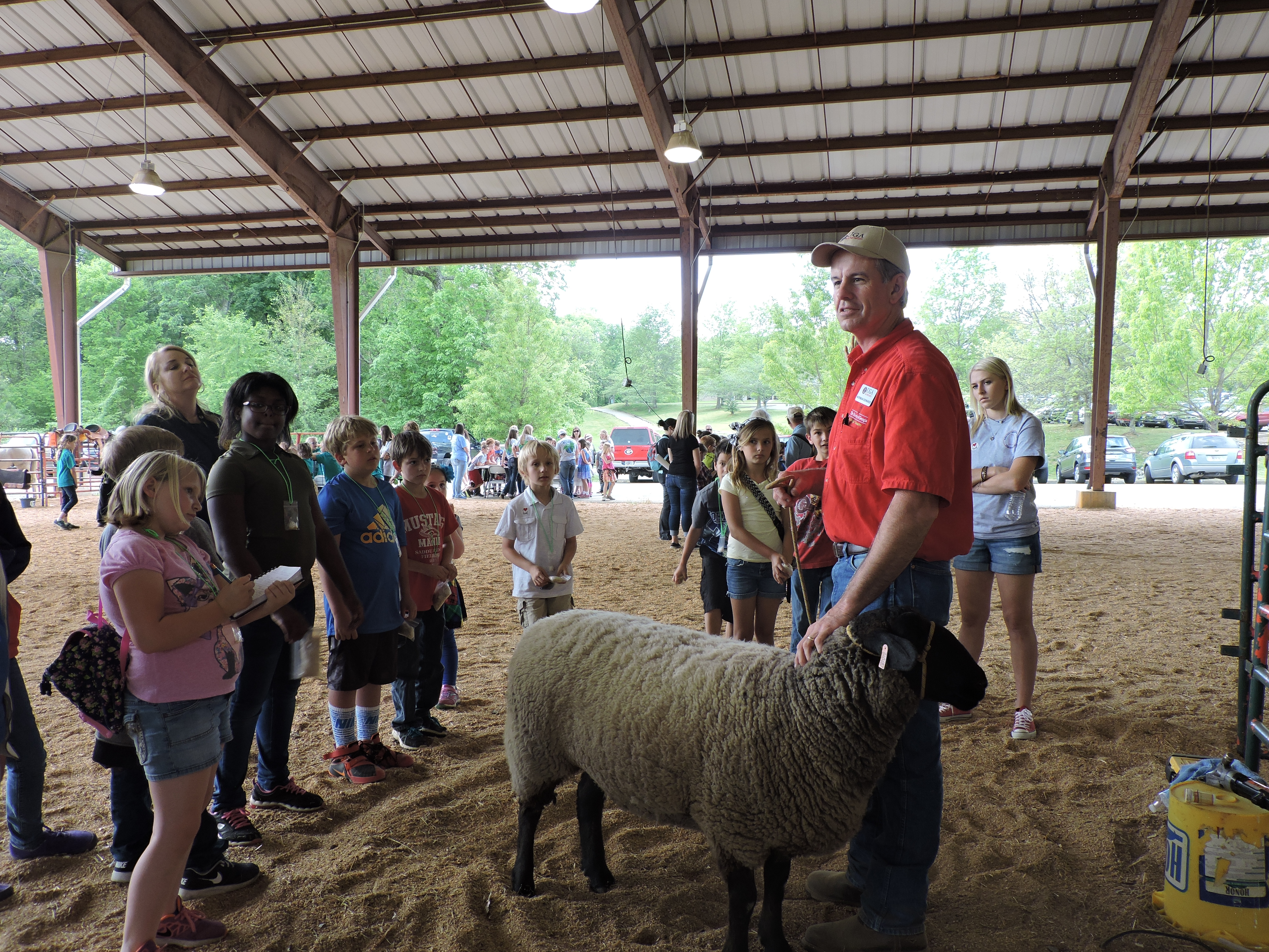 Walker County Extension Agent Norman Edwards tells Saddle Ridge School students about three things that come from sheep: wool, lanolin in lotion and meat. According to Walker County Young Farmer advisor Betts Berry, the county is home to 10-11 farms that are 1,000 acres or more and which offer a variety of products.