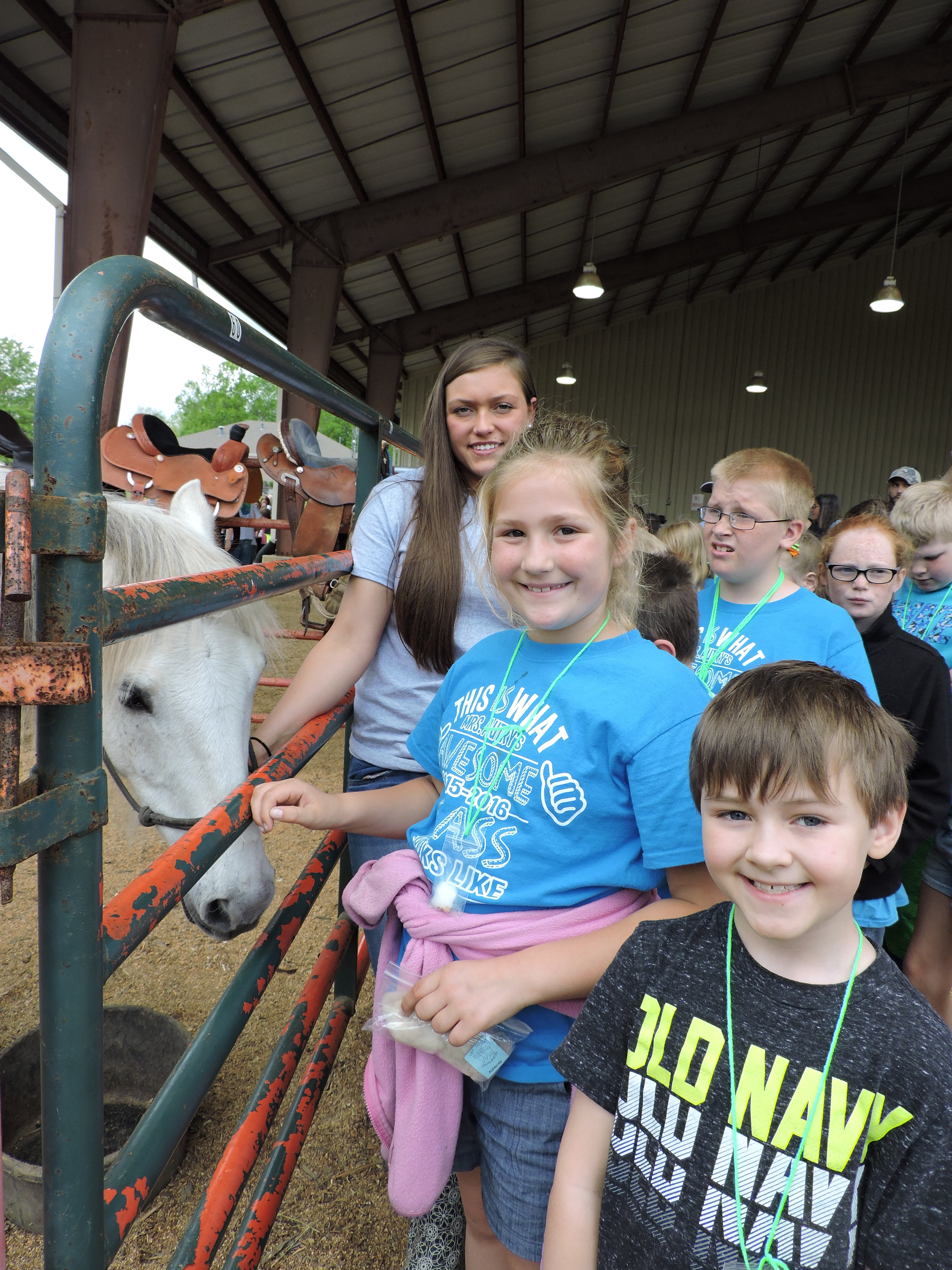 Staff photo by Katie WardGordon Lee High School student Josie Melton, back left, introduces Cherokee Ridge Elementary School students to one half of GLHS' Trojan mascot. Student Dalton Green dresses as a Trojan and rides the horse at events.