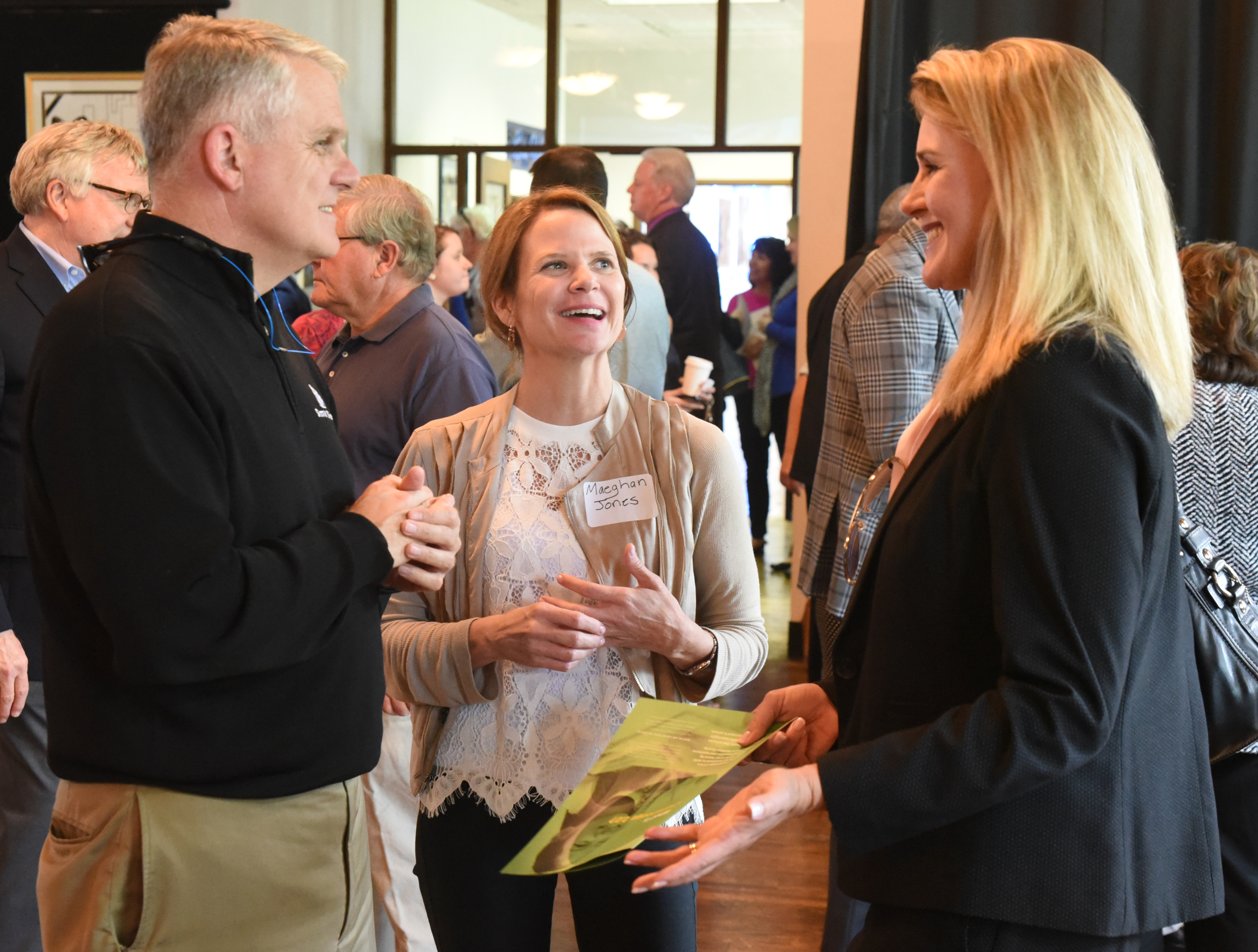 Cathy Scott, right, talks with Frank Hughes, left, and Maeghan Jones Monday at the Chattanooga 2.0 open house event held at the Bessie Smith Cultural Center. Scott is president of Bible in the Schools. Hughes, executive vice president of Smart Bank.
