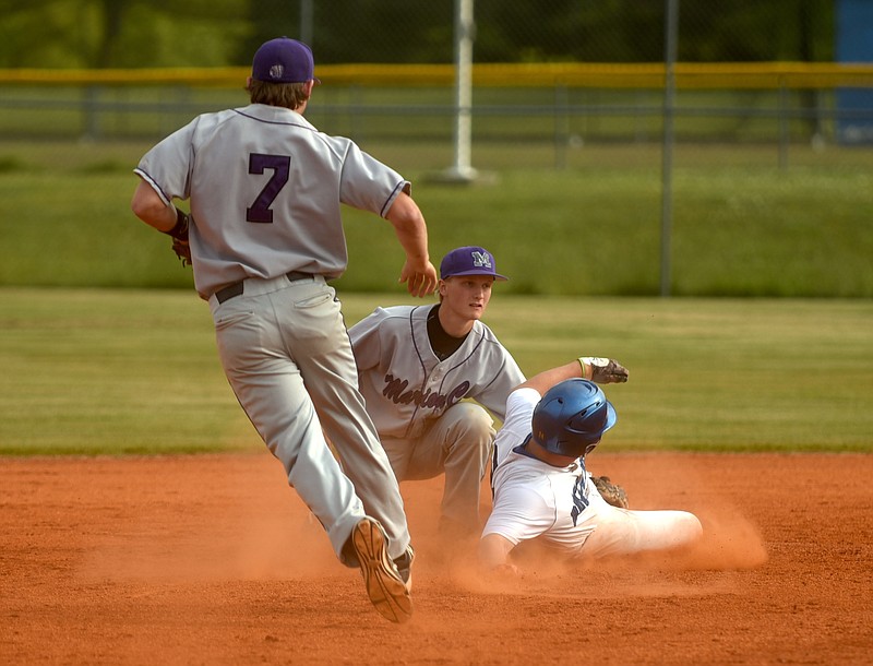 Marion County's Hayden Henry tags Boyd Buchanan's Bray Wilson in a run down as Hunter McClain approaches Monday, May 16, 2016 at Boyd Buchanan.