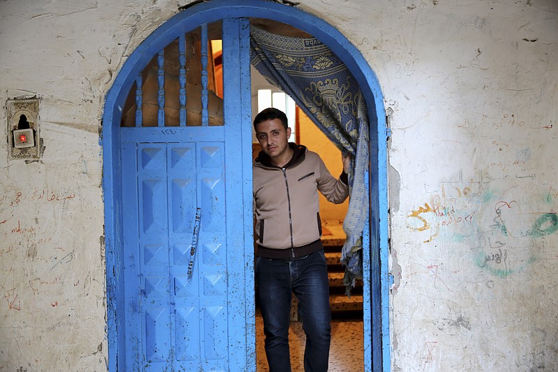 
              In this Tuesday, May 10, 2016 photo, Mohammed Al-Hissi, 25, who won a  scholarship for a Master's program in physics at the University of Triesta in Italy poses for a photo, at his family house in Gaza City. Gazans who have endured a border blockade by neighboring Egypt and Israel for almost a decade thought they were finally catching a break when Israel slightly eased restrictions on travel from the Hamas-ruled territory in recent months. But now Jordan appears to be emerging as an obstacle, routinely denying transit permits for Gazans and effectively preventing patients, university students and others with business abroad from leaving the coastal territory. (AP Photo/Adel Hana)
            