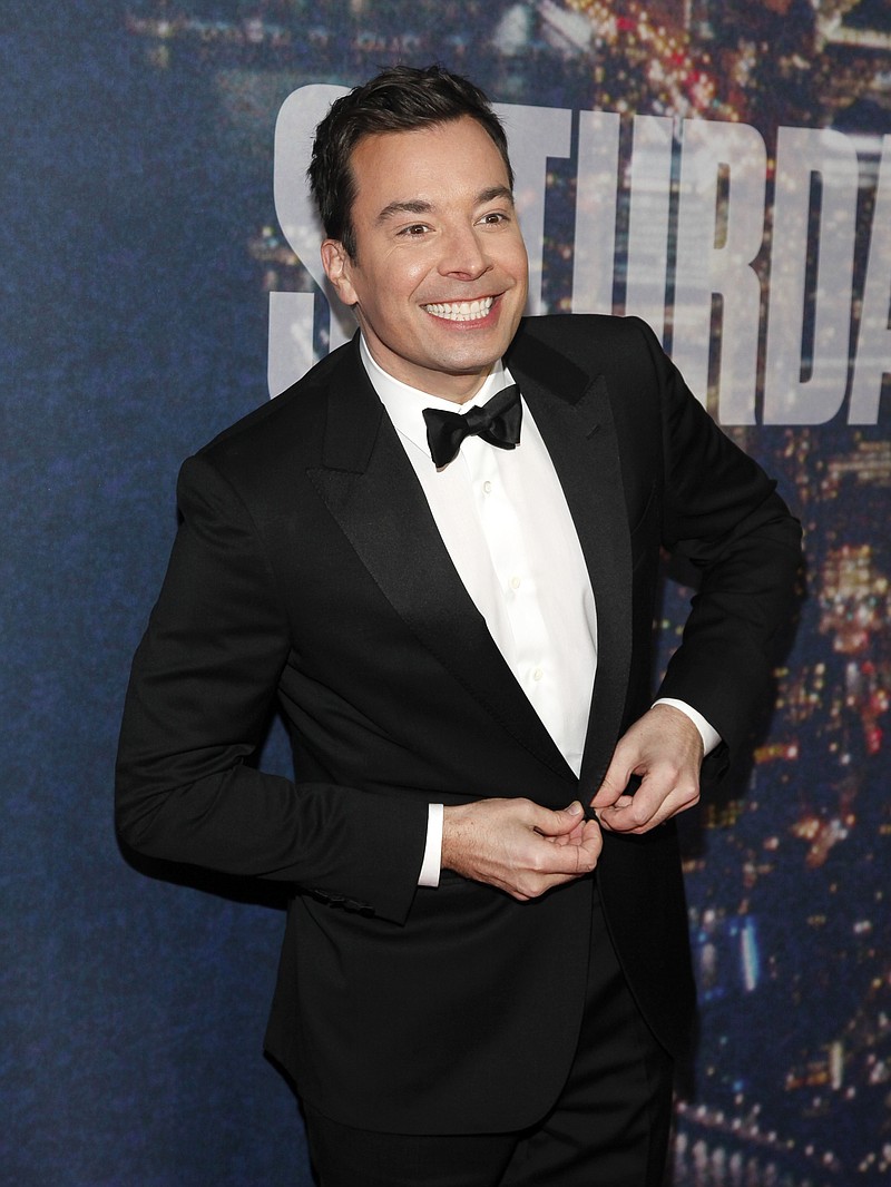 
              FILE - In this Feb. 15, 2015 file photo, Jimmy Fallon attends the SNL 40th Anniversary Special in New York. Fallon donned a period costume Monday, May 16, 2016, for a "Hamilton" takeoff at NBC's annual presentation of next season's schedule. The "Tonight" show host walked down the aisle at Radio City Music Hall for a comic spoof on the business of television. (Photo by Andy Kropa/Invision/AP, File)
            