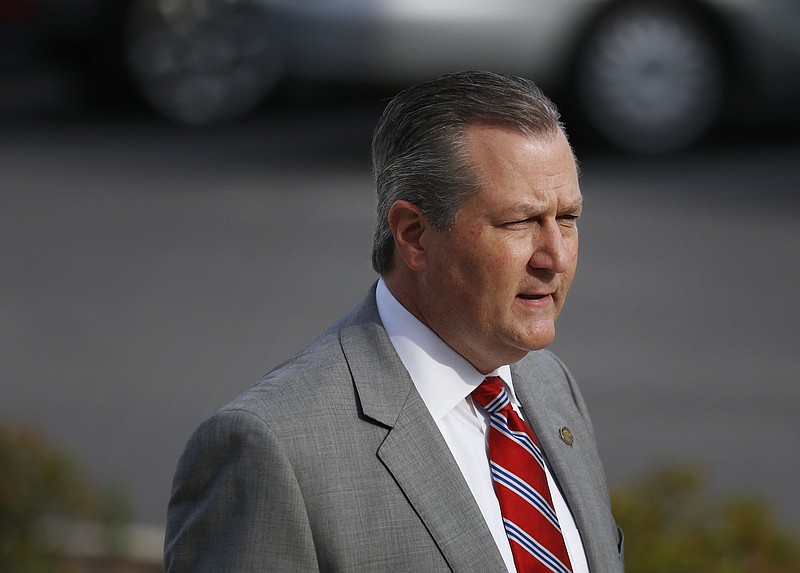 Rep. Mike Hubbard of Auburn, Ala., walks into the Lee County Justice Center during jury selection for the indicted Alabama speaker of the House, Monday, May 16, 2016, in Opelika, Ala.