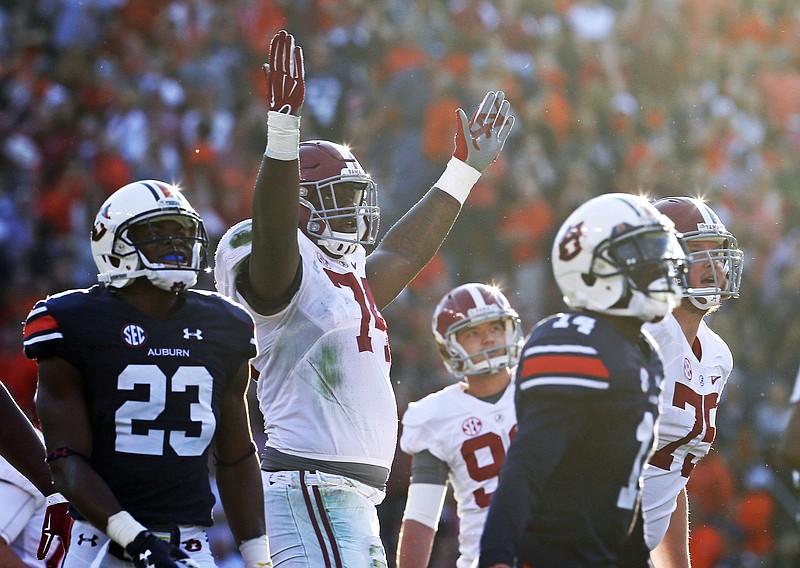 Alabama offensive tackle Cam Robinson, shown here celebrating a field goal in last year's Iron Bowl win at Auburn, was arrested early Tuesday morning in his hometown of Monroe, La.