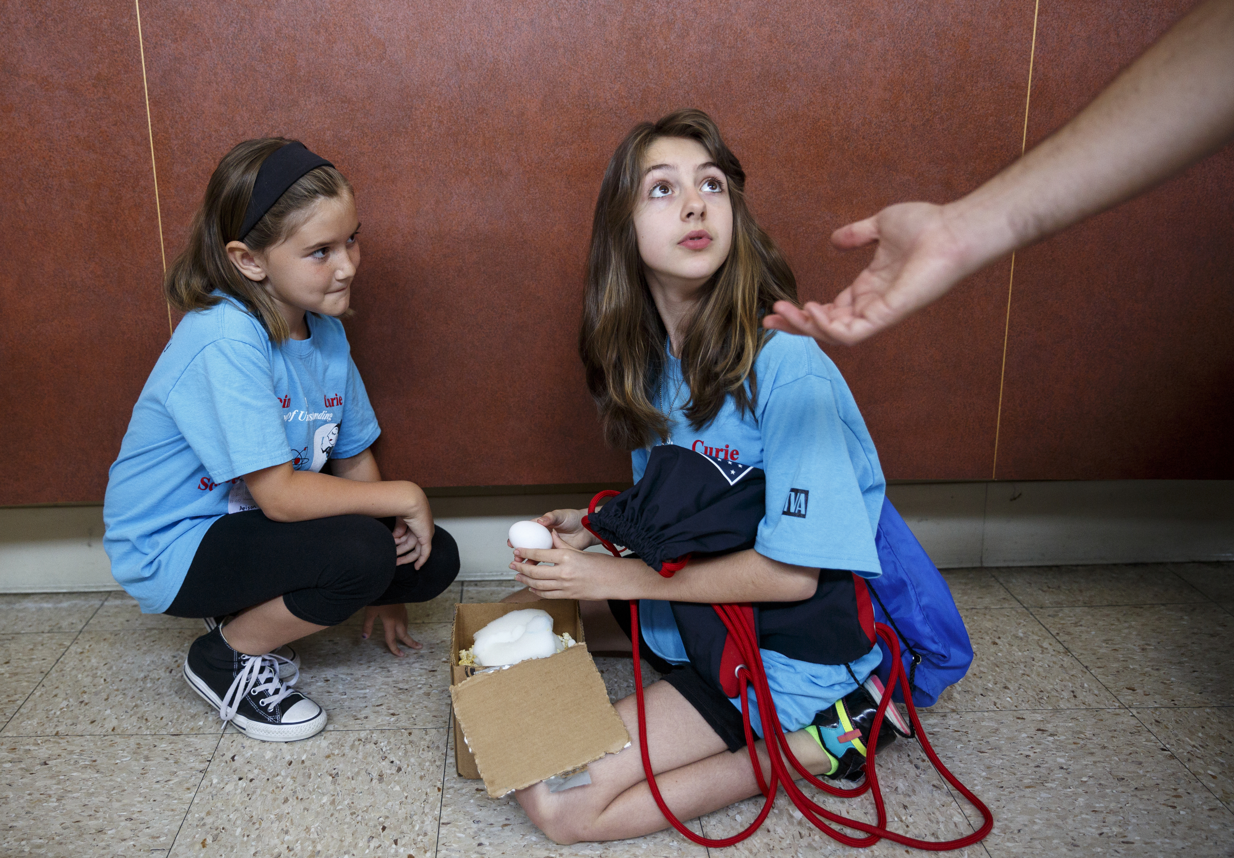 Morgan Prichard, left, and Julia Murphy check to make sure their egg survived the egg drop during the 10th annual regional Elementary Science Olympiad at Chattanooga State Technical Community College on Tuesday, May 17, 2016, in Chattanooga, Tenn. Hundreds of elementary students competed in science-based competitions that included egg drops, pressurized rockets, and bridge building.