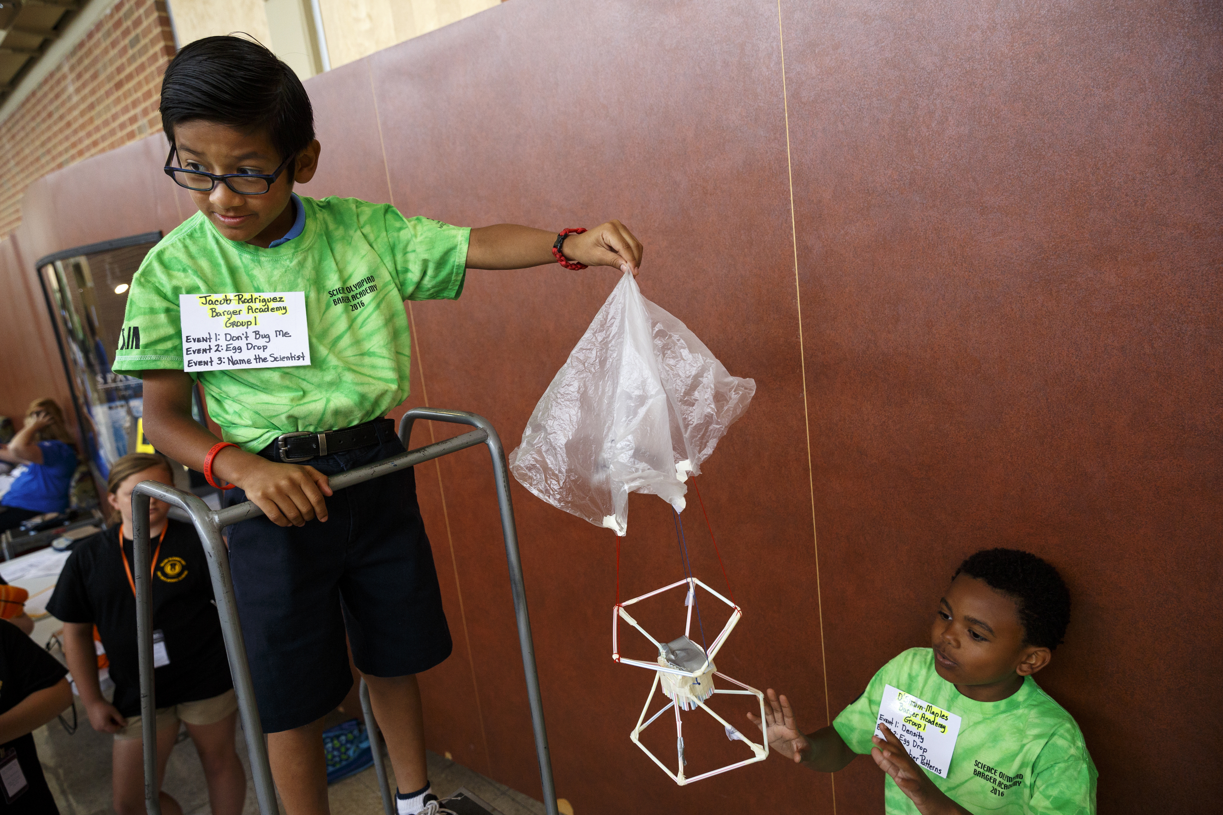 Jacob Rodriguez, left, prepares to drop an egg with a parachute with partner D'Shawn Maples during the 10th annual regional Elementary Science Olympiad at Chattanooga State Technical Community College on Tuesday, May 17, 2016, in Chattanooga, Tenn. Hundreds of elementary students competed in science-based competitions that included egg drops, pressurized rockets, and bridge building.