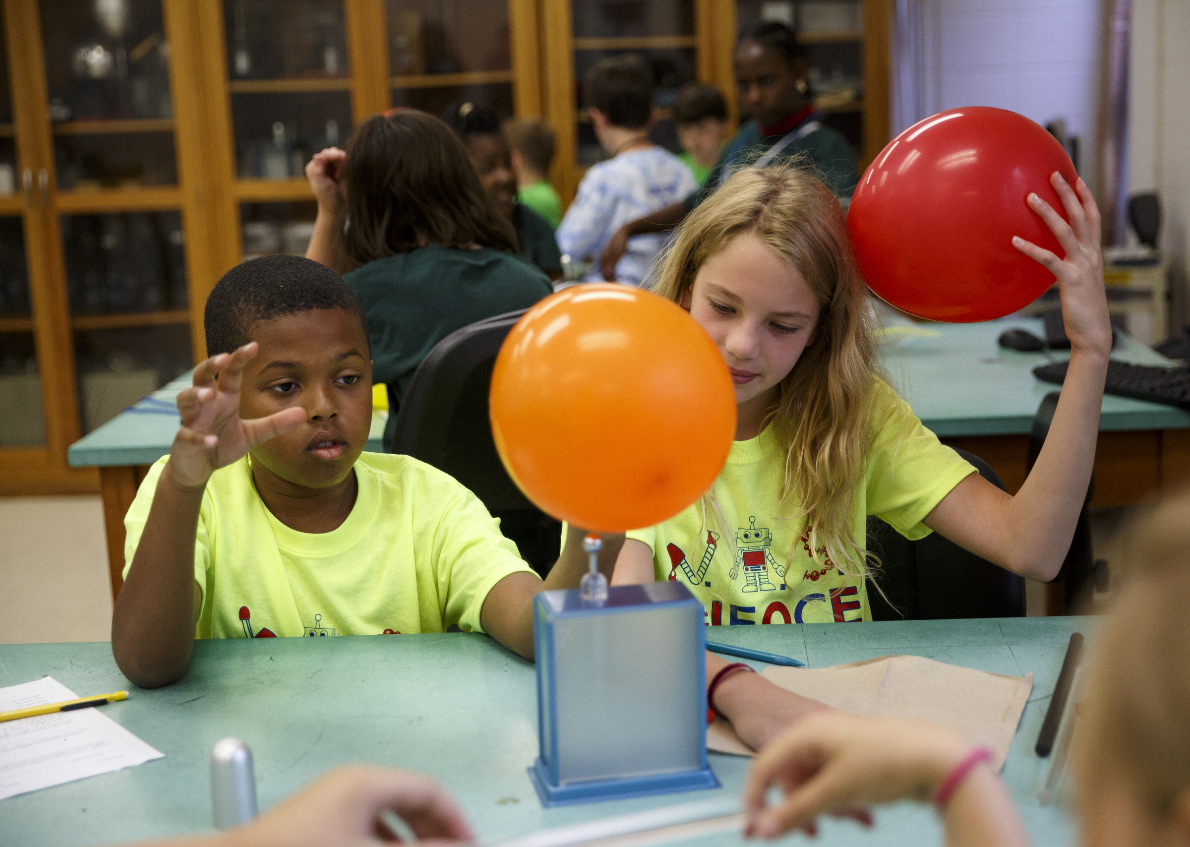 Daniel Boddie, left, and Jaxon Thurman experiment with static electricity in a classroom during the 10th annual regional Elementary Science Olympiad at Chattanooga State Technical Community College on Tuesday, May 17, 2016, in Chattanooga, Tenn. Hundreds of elementary students competed in science-based competitions that included egg drops, pressurized rockets, and bridge building.