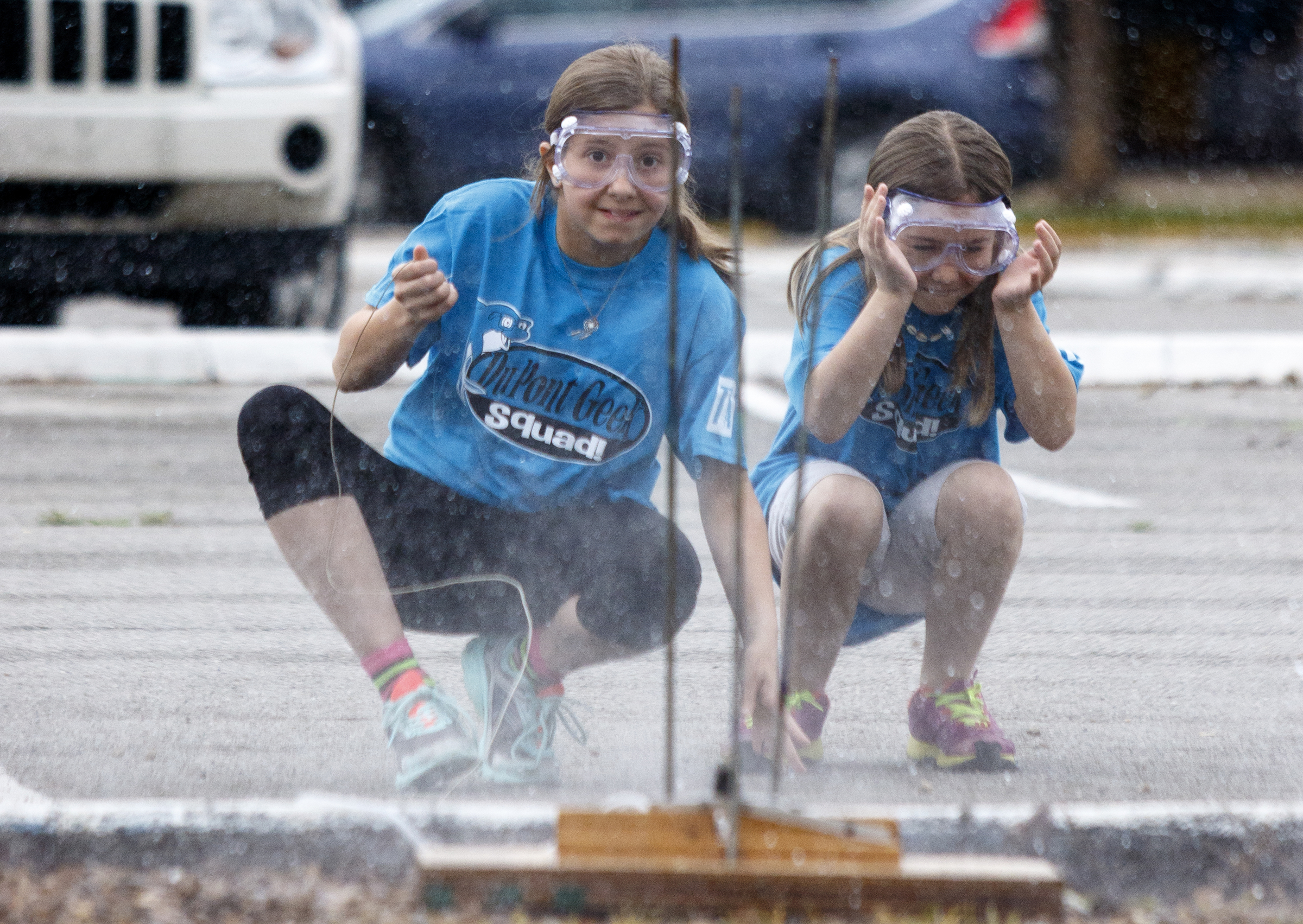 Erica Bannister, left, and Nahla Hanks react as they launch their pressurized water rocket during the 10th annual regional Elementary Science Olympiad at Chattanooga State Technical Community College on Tuesday, May 17, 2016, in Chattanooga, Tenn. Hundreds of elementary students competed in science-based competitions that included egg drops, pressurized rockets, and bridge building.