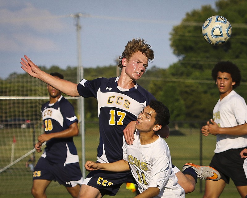 Chattanooga Christian's Jared Boldt heads the ball past Central Magnet's Ryan O'Boyle during Tuesday's Region 4A/AA soccer match in Murfreesboro, Tenn.