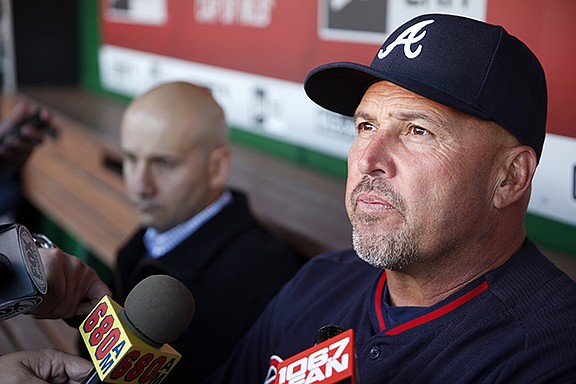 FILE - In this April 13, 2016, file photo, Atlanta Braves manager Fredi Gonzalez, right, with general manager John Coppolella sitting at left, talks with the media before a baseball game against the Washington Nationals at Nationals Park, in Washington. The Atlanta Braves have fired manager Fredi Gonzalez, who couldn’t survive the worst record in the majors.  Braves general manager John Coppolella confirmed the firing of Gonzalez, in his sixth season, Tuesday, May 17, 2016.  (AP Photo/Alex Brandon, File)
