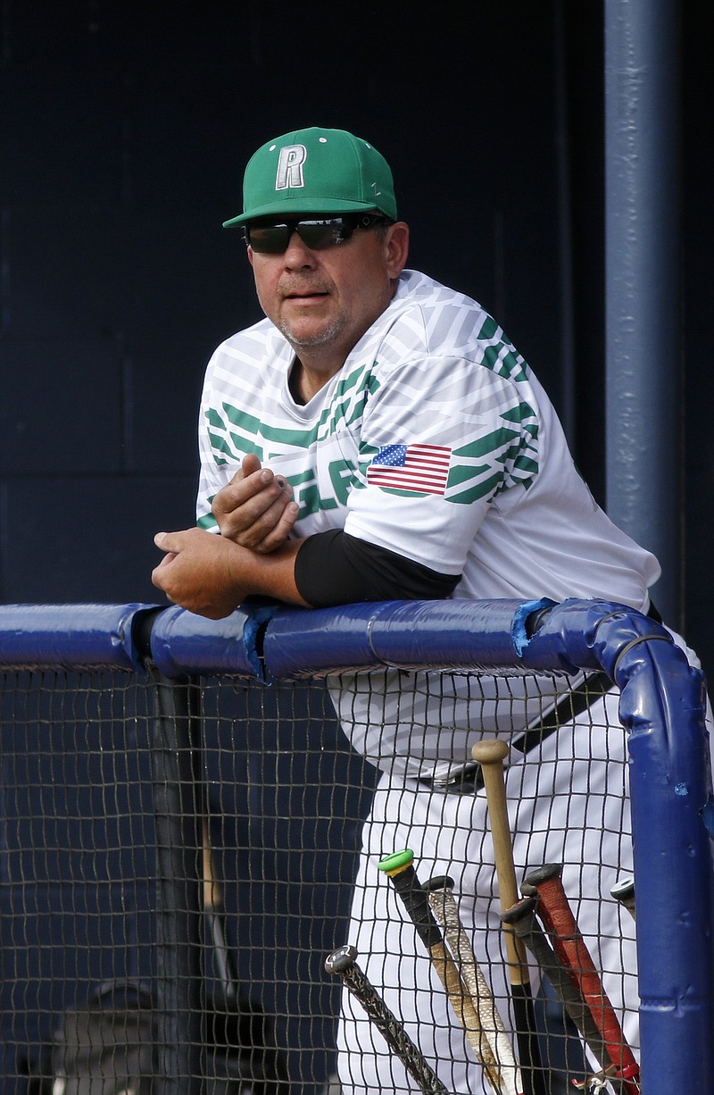 Rhea County baseball coach Rusty Ray watches from the dugout during their prep baseball game against Soddy-Daisy at Soddy-Daisy High School on Thursday, April 21, 2016, in Soddy-Daisy, Tenn.