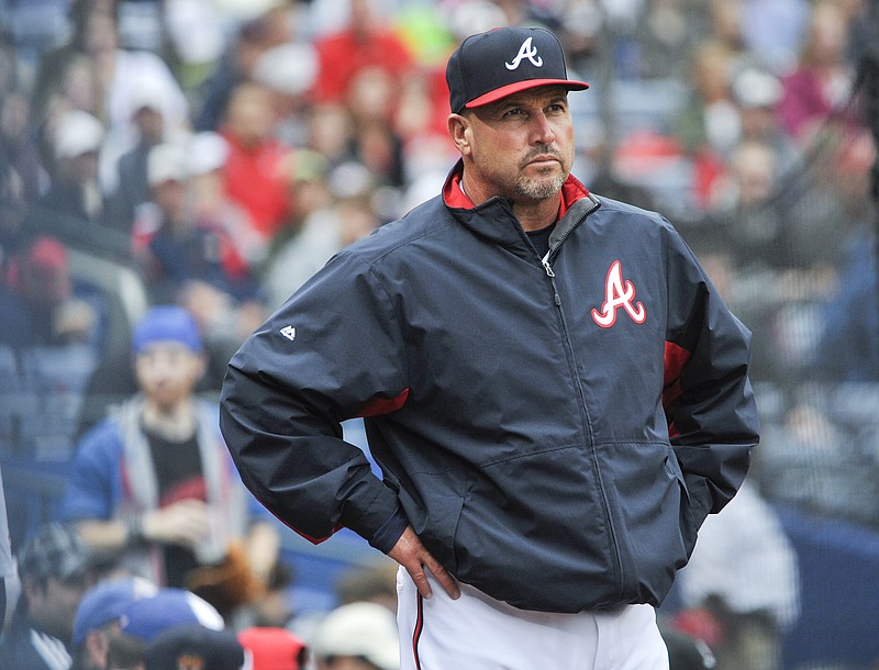 FILe - In this Oct. 4, 2015, file photo, Atlanta Braves manager Fredi Gonzalez (33) waits for a review of a call during the fourth inning of the second baseball game of a doubleheader against the St. Louis Cardinals, in Atlanta. The Atlanta Braves have fired manager Fredi Gonzalez, who couldnt survive the worst record in the majors.  Braves general manager John Coppolella confirmed the firing of Gonzalez, in his sixth season, Tuesday, May 17, 2016. (AP Photo/John Amis, File)