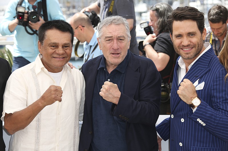 
              Former boxer Roberto Duran, from left, and actors Robert De Niro and Edgar Ramirez pose for photographers during a photo call for "Hands of Stone" at the 69th international film festival, Cannes, southern France, Monday, May 16, 2016. (AP Photo/Joel Ryan)
            