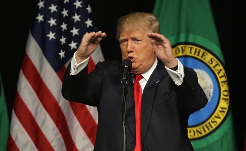 
              In this Republican presidential candidate Donald Trump speaks during a rally in Spokane, Wash. Trump is moving quickly to install political operatives in more than a dozen states, targeting Maine and Minnesota among others that traditionally favor Democrats, as the Republican White House contender lays the groundwork for an expanded electoral battlefield.  (AP Photo/Ted S. Warren)
            