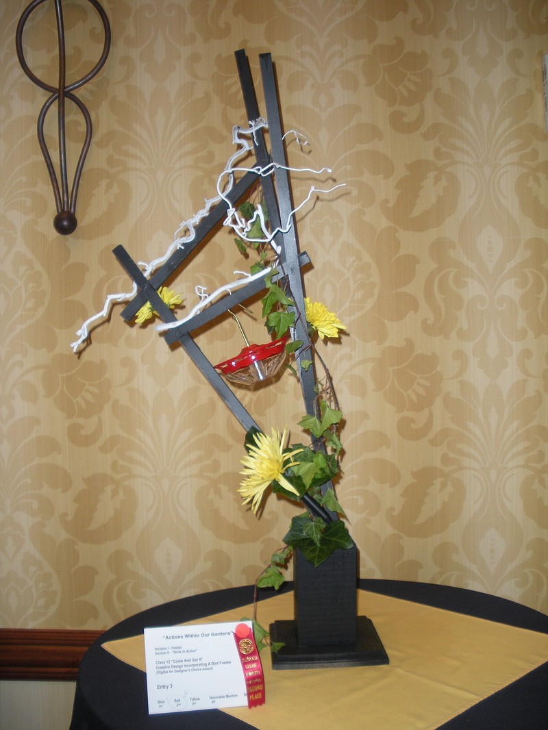 Joyce Merritt of the Hickory Valley Garden Club created this bird feeder and chrysanthemum design for the State Flower Show in Murfreesboro, Tenn., in April.