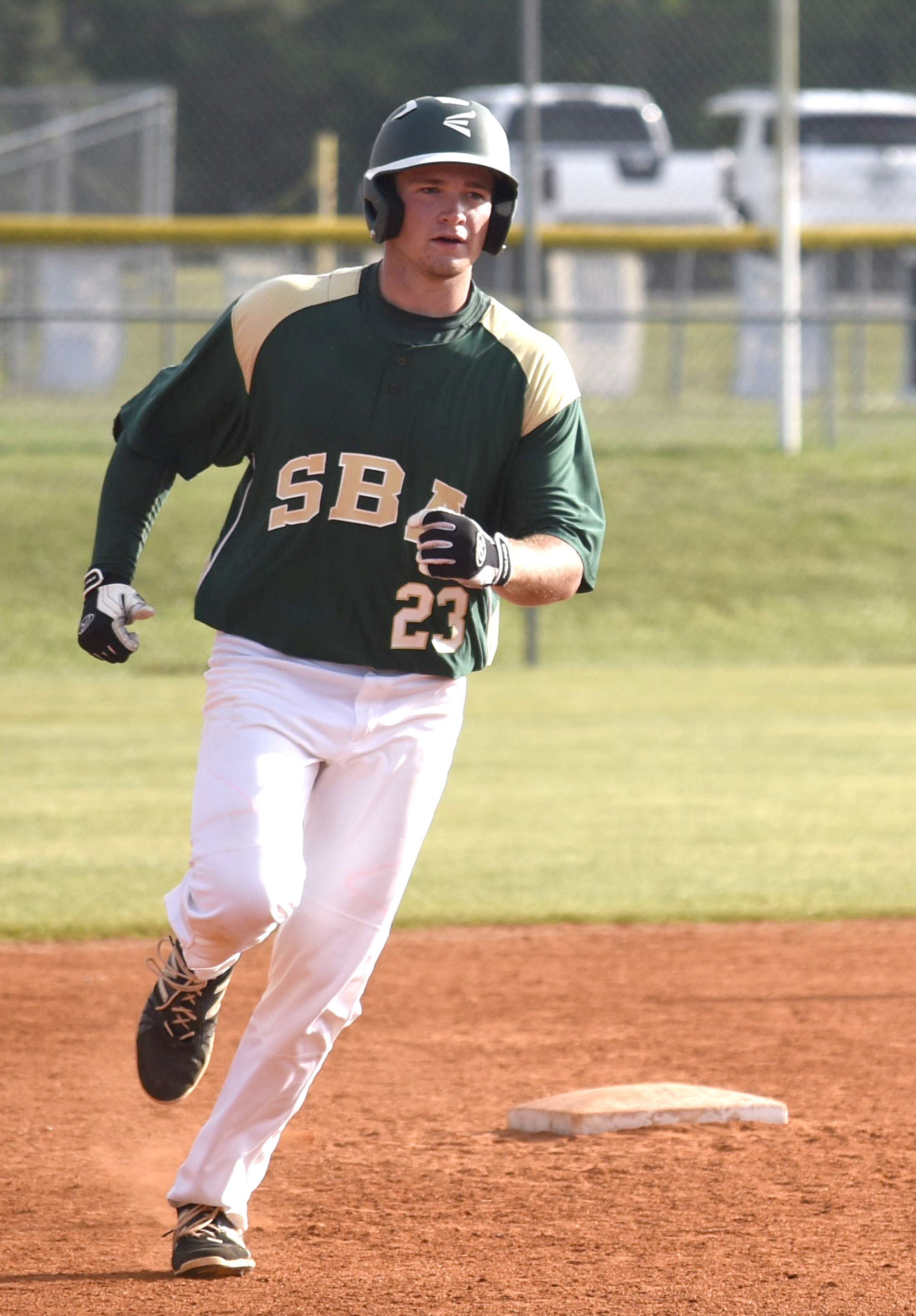 Silverdale's Blake Howard (23) rounds second after hitting a three-run homer over the right field fence. The Silverdale Baptist Seahawks visited the Boyd-Buchanan Buccaneers in the Region 3-A championship baseball game May 18, 2016.