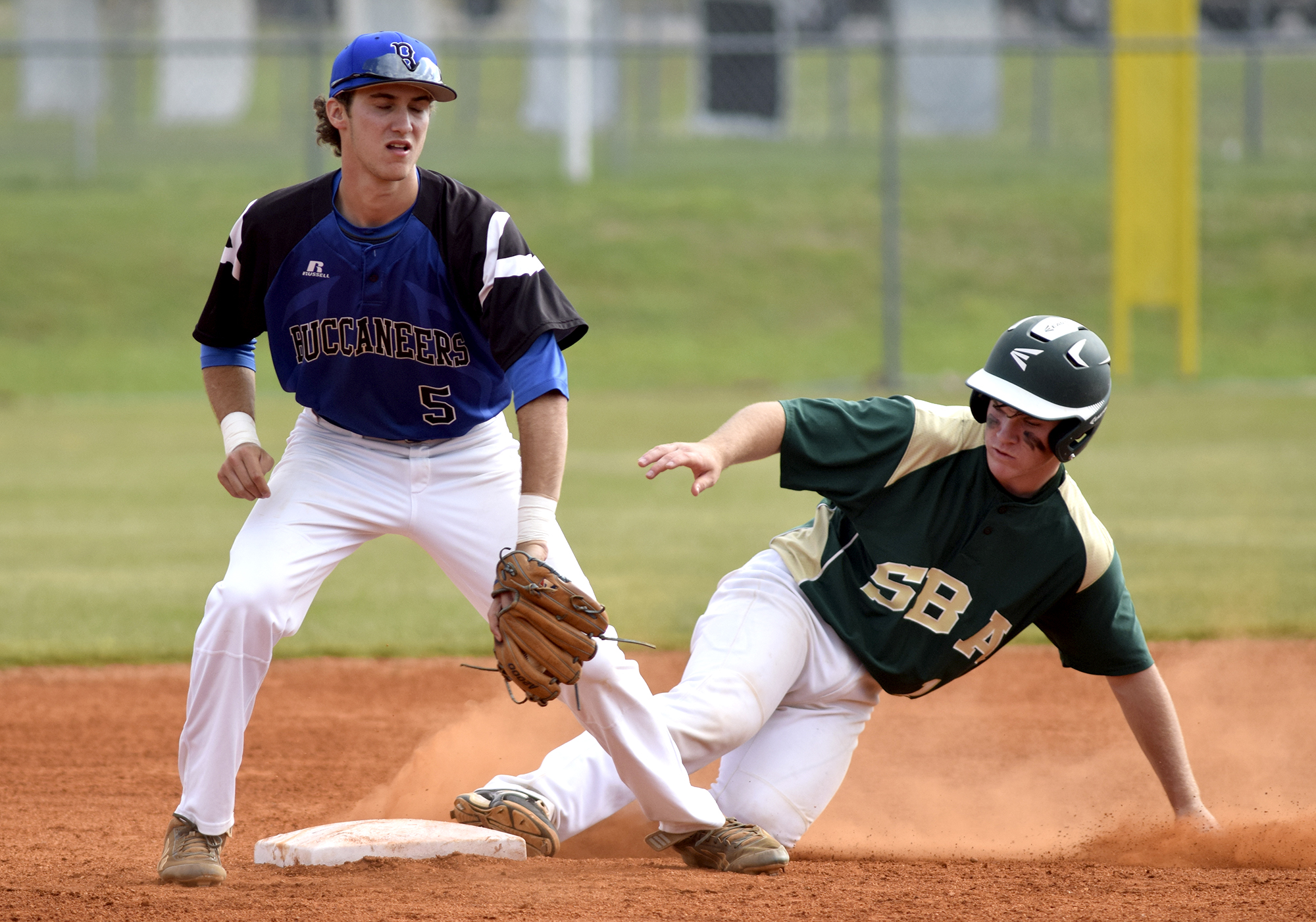 Silverdale's Hayden Spencer (10) slides safely into second with a stolen base as Boyd-Buchanan shortstop Cade Evans takes the late throw. The Silverdale Baptist Seahawks visited the Boyd-Buchanan Buccaneers in the Region 3-A championship baseball game May 18, 2016.