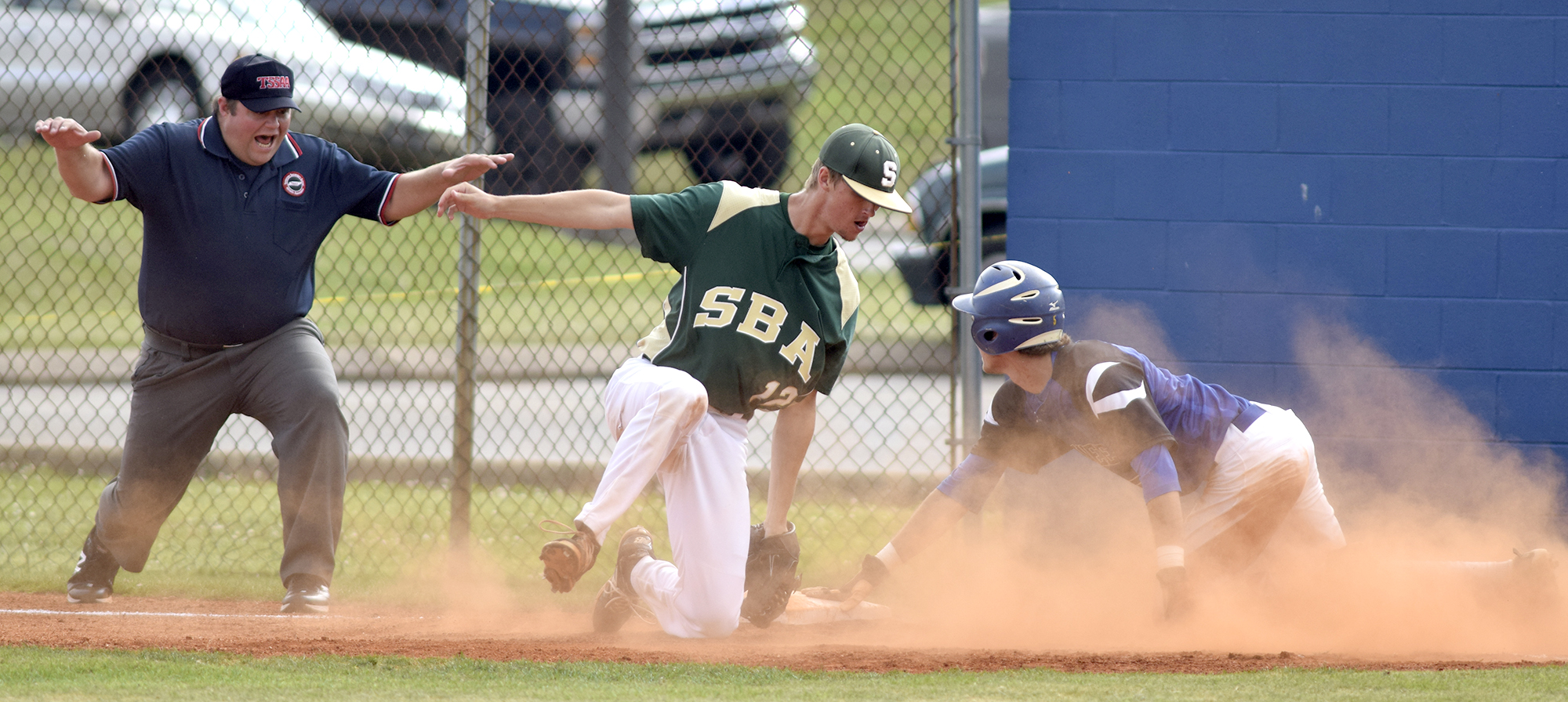 The umpire calls Boyd-Buchanan's Cade Evans (5) safe at first as he was almost doubled off on the play. Taking the throw is Silverdale first baseman Blake Howard (23). The Silverdale Baptist Seahawks visited the Boyd-Buchanan Buccaneers in the Region 3-A championship baseball game May 18, 2016.