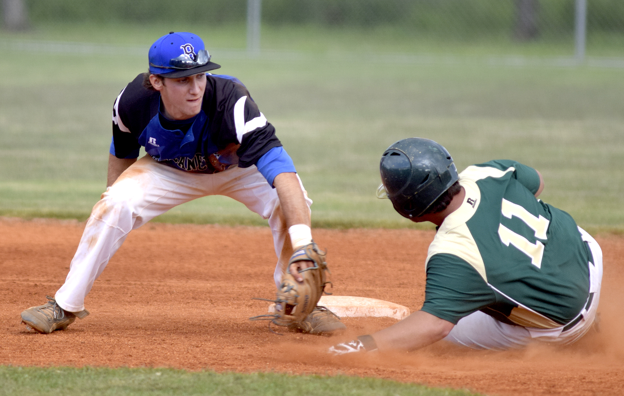 Boyd-Buchanan shortstop Cade Evans (5) tags out Silverdale's Noah Rogers (11) as he attemtped to steal second. The Silverdale Baptist Seahawks visited the Boyd-Buchanan Buccaneers in the Region 3-A championship baseball game May 18, 2016.