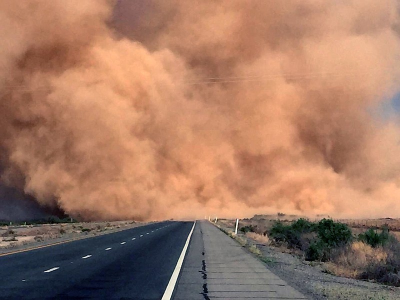 
              This Monday, May 16, 2016 photo, shows a dust storm on Interstate 10 near San Simon, Ariz. State officials say the owner of a farm that was cleared but not planted will face fines if the owner doesn't act to contain the soil, which is loose and easily picked up by winds. A  dry winter means the Southwest is seeing a greater number of dust storms. (Arizona Department of Public Safety via AP)
            