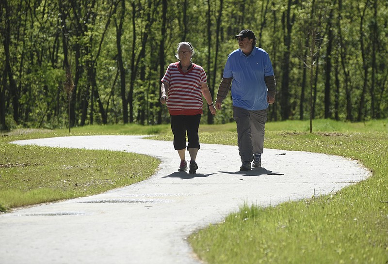 Debbie and Steve Burnette walk on a newly-completed section of the Tennessee Riverwalk on April 7. The new section connects the South Chickamauga greenway to the Riverwalk.