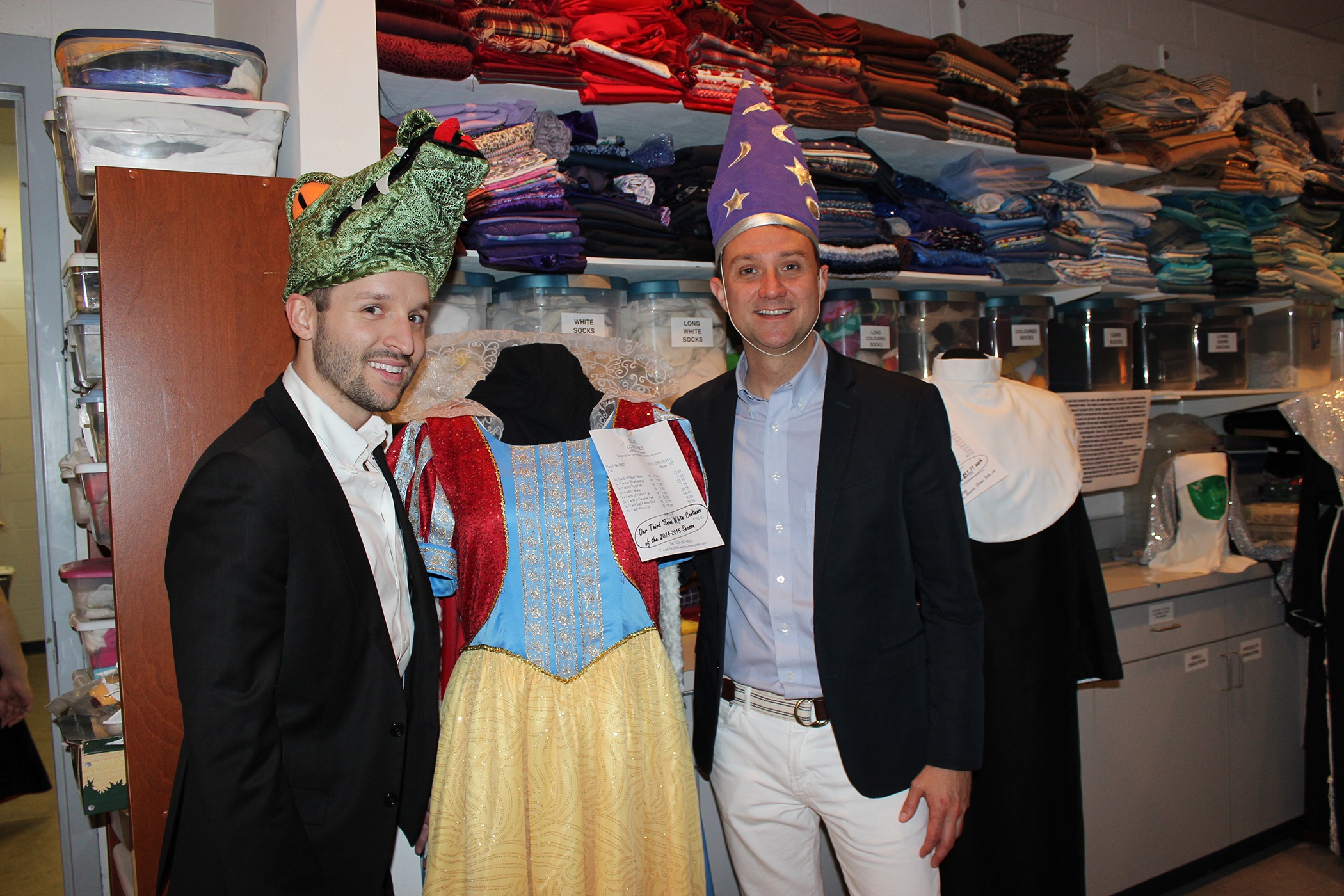 Casey Yoshida, left, and Ryan King have fun in the costume shop.