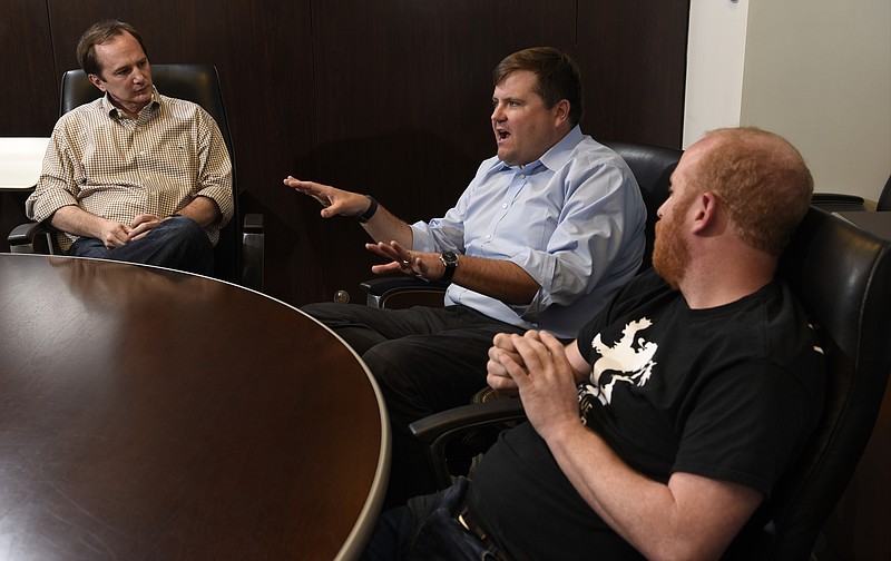 Photographed at the offices of the Lamp Post Group on Monday, Apr. 4, 2016, in Chattanooga, Tenn., Barry Large, Ted Alling and Allan Davis, from left, are the founders of Access America Transport, a company they sold in 2014. They have recently launched Dynamo, a company that is a logistics accelerator. 