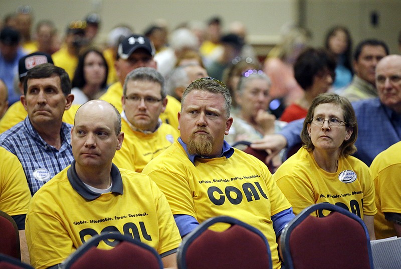 
              A crowd including a large contingent of coal supporters wearing matching yellow shirts packed into convention hall meeting room for a public hearing to weigh in about the federal government's coal-leasing reform Thursday, May 19, 2016, in Salt Lake City. This is the second of six hearings planned by the U.S. Bureau of Land Management to get feedback on several aspects the government's coal leasing program, including a three-year federal leasing moratorium announced in January by Interior Secretary Sally Jewell. (AP Photo/Rick Bowmer)
            