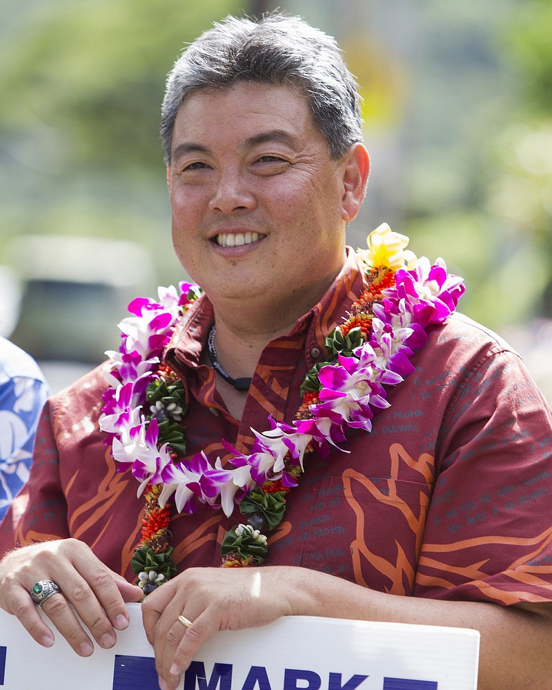 
              File- This Nov. 4, 2014, file photo shows Hawaii Democratic Congressional candidate, State Rep Mark Takai doing some last minute campaigning on election day in Honolulu.  Takai has announced he will not seek a second term in Congress due to health problems. Takai was diagnosed with pancreatic cancer last year. He said in a statement Thursday that he had planned to fight the cancer while running for re-election but recently learned the disease had spread. Takai says that for the sake of his family, he needs to focus on getting better instead of getting re-elected. (AP Photo/Marco Garcia, File)
            