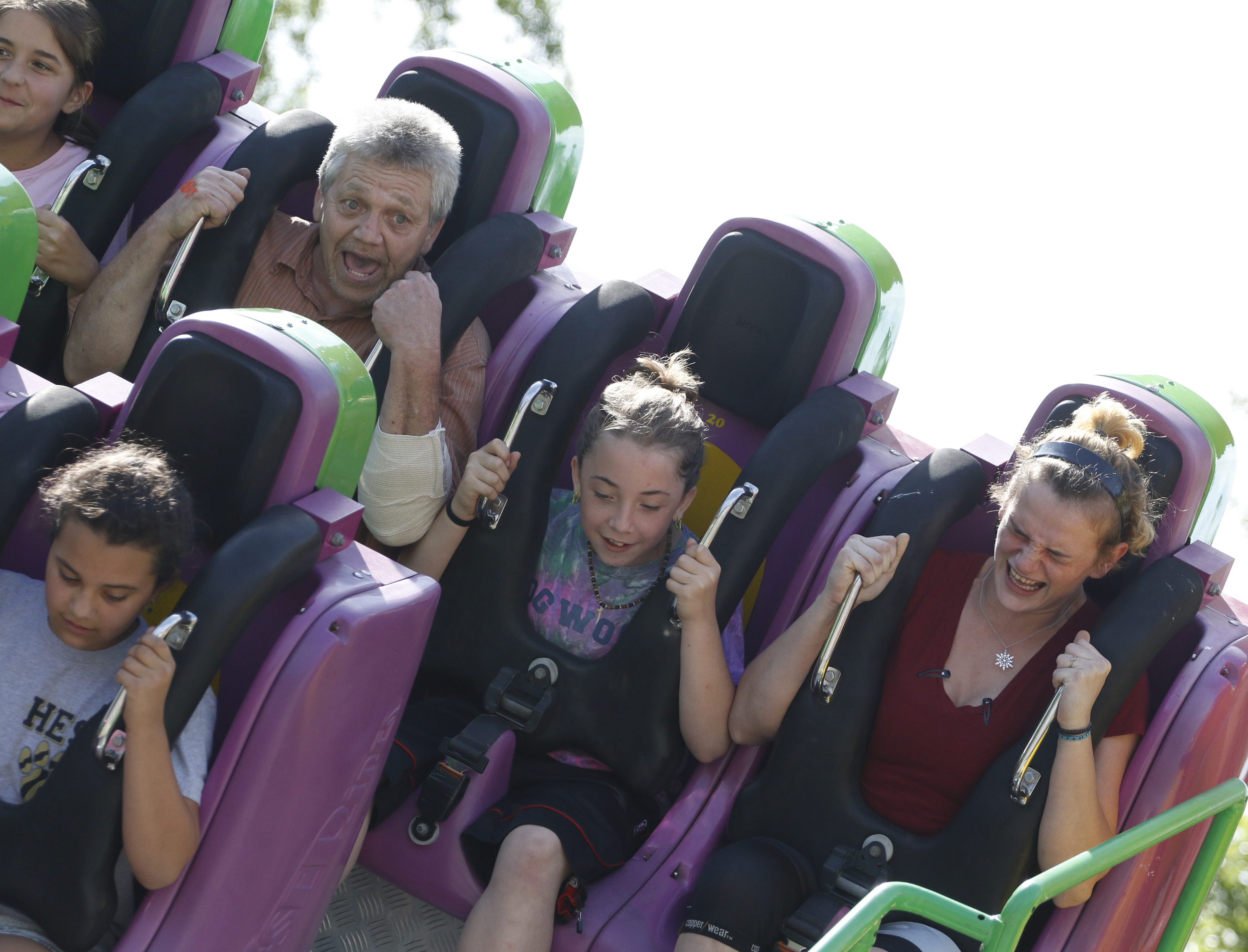 Staff Photo by Dan Henry / The Chattanooga Times Free Press- 5/19/16. Kirk Roberts rides an attraction with his granddaughter Anabel Roberts, 10, and his fiancee Sheri Taylor while at Lake Winnepesaukah Amusement Park on Thursday, May 19, 2016. Roberts took in his daughterճ three children after she was killed by Catherine Goins who wore a prosthetic baby bump lying about being pregnant and trying to steal one of NataliaRobertճ children.