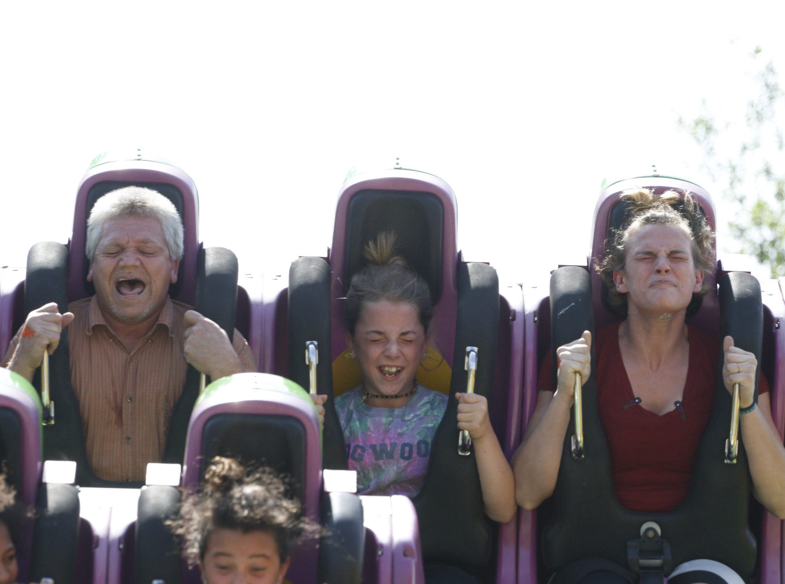 Staff Photo by Dan Henry / The Chattanooga Times Free Press- 5/19/16. Kirk Roberts rides an attraction with his granddaughter Anabel Roberts, 10, and his fiancee Sheri Taylor while at Lake Winnepesaukah Amusement Park on Thursday, May 19, 2016. Roberts took in his daughterճ three children after she was killed by Catherine Goins who wore a prosthetic baby bump lying about being pregnant and trying to steal one of NataliaRobertճ children.