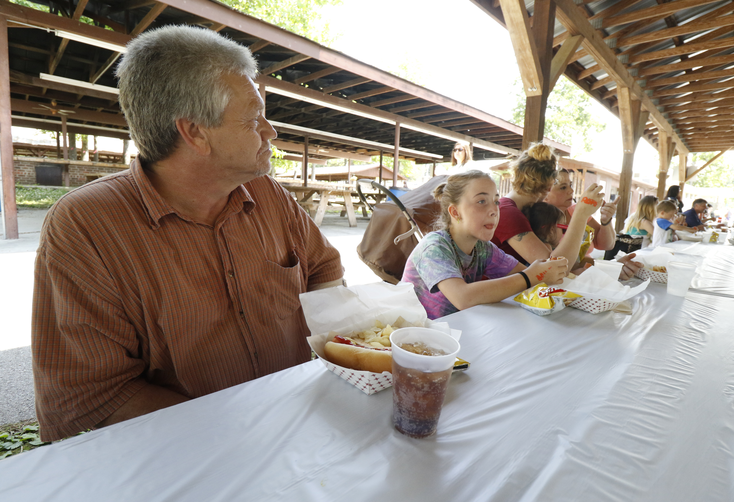 Staff Photo by Dan Henry / The Chattanooga Times Free Press- 5/19/16. Kirk Roberts spends time with his grandchildren at Lake Winnepesaukah Amusement Park on Thursday, May 19, 2016. Roberts took in his daughterճ three children after she was killed by Catherine Goins who wore a prosthetic baby bump lying about being pregnant and trying to steal one of NataliaRobertճ children.