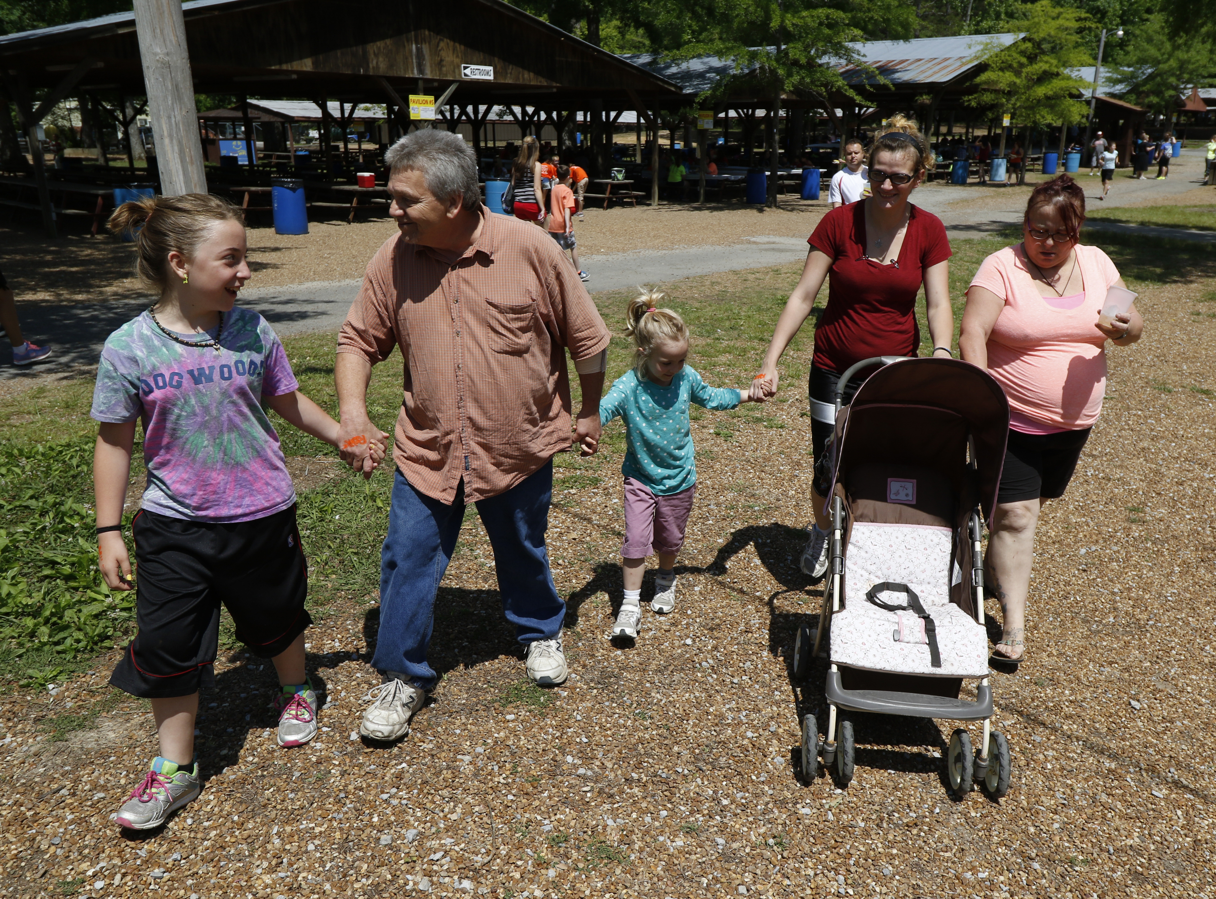 Staff Photo by Dan Henry / The Chattanooga Times Free Press- 5/19/16. Kirk Roberts, spends time with his grandchildren and family at Lake Winnepesaukah Amusement Park on Thursday, May 19, 2016. Roberts took in his daughterճ three children after she was killed by Catherine Goins who wore a prosthetic baby bump lying about being pregnant and trying to steal one of NataliaRobertճ children.