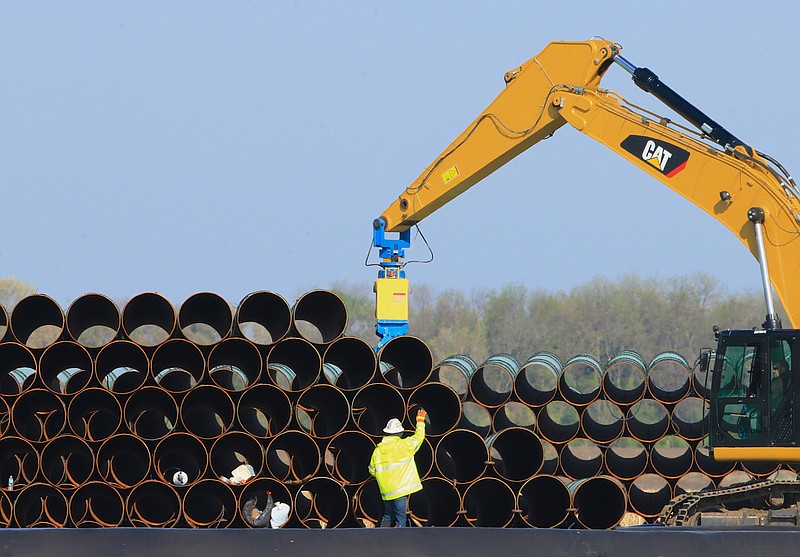 
              FILE - In this May 9, 2015 file photo, pipes for the proposed Dakota Access oil pipeline that will stretch from the Bakken oil fields in North Dakota to Illinois are stacked at a staging area in Worthing, S.D. Construction on the pipeline is now underway in North Dakota, South Dakota and Illinois, three of the four states that will carry the oil from western North Dakota. The pipeline also will cross Iowa, but regulators there have declined to act quickly on a request to allow Texas-based Energy Transfer Partners to begin construction in that state. (AP Photo/Nati Harnik, File)
            
