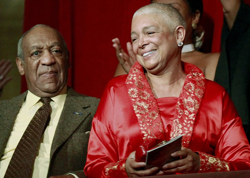 
              FILE - In this Oct. 26, 2009 file photo, comedian Bill Cosby, left, and his wife Camille appear at the John F. Kennedy Center for Performing Arts before he received the Mark Twain Prize for American Humor in Washington. According to a transcript of the deposition released Friday, May 20, 2016, Camille Cosby refused to answer dozens of questions during a combative February deposition. She was subjected to intense questioning by a lawyer for seven women who claim the comedian branded them as liars after they accused him of sexually assaulting them decades ago. (AP Photo/Jacquelyn Martin, File)
            