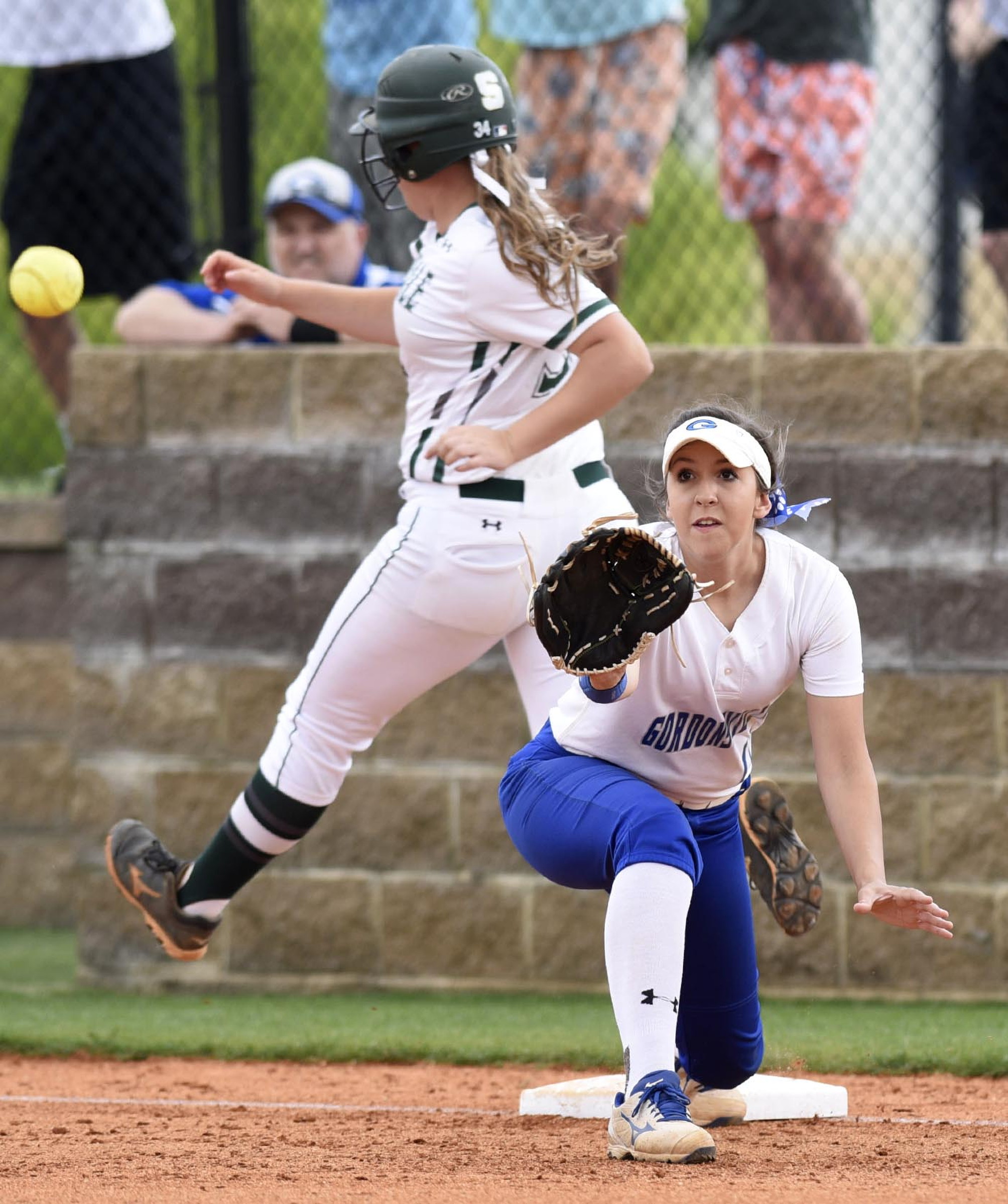 Silverdale's Lindsey Newell (34) beats the throw to first for a single.  Gordonsville first baseman Katlyn Ray (11) defends on the play.  The Gordonsville Tigererettes visited Silverdale Baptist Academy in a TSSAA Sectional matchup Saturday May 21, 2016.