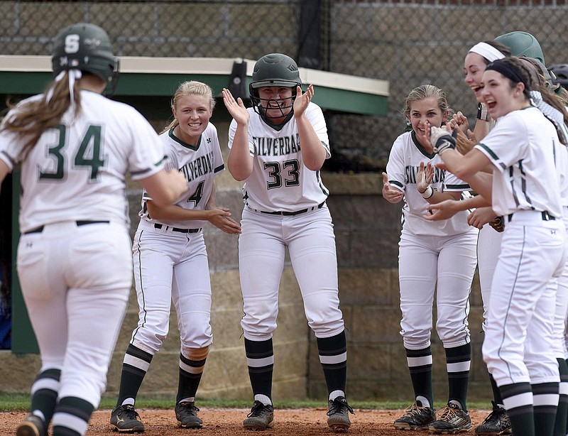 Silverdale Baptist Academy teammates wait behind home plate for Lindsey Newell (34) to cross with a home run Saturday. The Lady Seahawks are 37-3 after blasting Gordonsville 17-0 in five innings in a Class A state sectional.