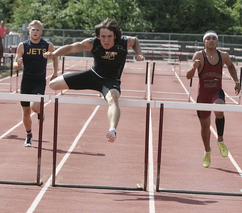 Rhea County High School senior Chase Sholl, center, won both hurdles races while finishing first in seven of 10 events in decathlon competition at a state-qualiyfing sectional meet last week in Murfreesboro. Sholl won the Class AAA decathlon state title last year.