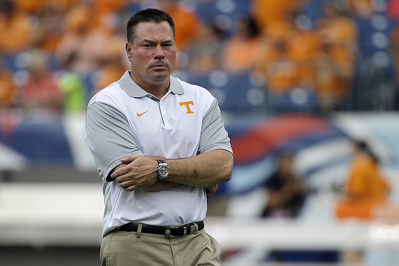 Tennessee head coach Butch Jones watches his players warm up for an NCAA college football game against Bowling Green Saturday, Sept. 5, 2015, in Nashville, Tenn. (AP Photo/Mark Humphrey)