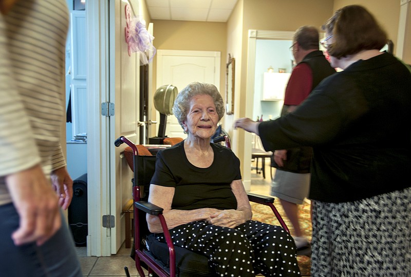 
              In this Friday, May 13, 2016 photo, Audrey Roberts smiles after receiving a fresh wash and set by Jerri Roman at the Wrap It Up salon in Bowling Green, Ky. Evan LaPointe has started GoFundMe account to keep his former babysitter in her own home and out of a nursing home. (Miranda Pederson/Daily News via AP)
            