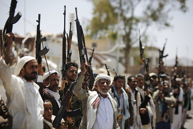 
              FILE- In this Thursday, May 19, 2016 file photo, Shiite Houthi tribesmen hold their weapons as they chant slogans during a tribal gathering showing support for the Houthi movement, in Sanaa, Yemen. During a Saturday, May 21, 2016 meeting in the Qatari capital, Doha, with U.N. Secretary-General Ban Ki-moon and the emir of Qatar, Yemeni President Abed Rabbo Mansour Hadi agreed to send the government delegation back to the talks, according to a U.N. statement. (AP Photo/Hani Mohammed, File)
            