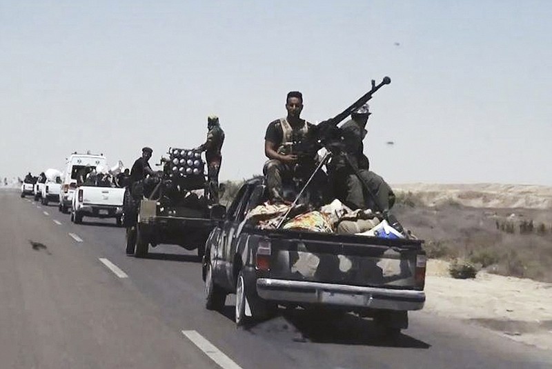 
              File- This July 13, 2015, file photo shows Iraqi security forces backed by Shiite and Sunni pro-government fighters preparing to attack Islamic State group positions in Fallujah, 40 miles (65 kilometers) west of Baghdad, Iraq.  Iraqi Prime Minister Haider al-Abadi announced the beginning of military operations to retake the Islamic State-held held city of Fallujah, west of Baghdad in a televised address Sunday, May 22, 2016. Iraqi forces are "approaching a moment of great victory" against the Islamic State group, al-Abadi said surrounded by top military commanders from the ministry of defense and the country's elite counter terrorism forces. Fallujah has been under the control of IS for more than two years. (AP Photo, File)
            