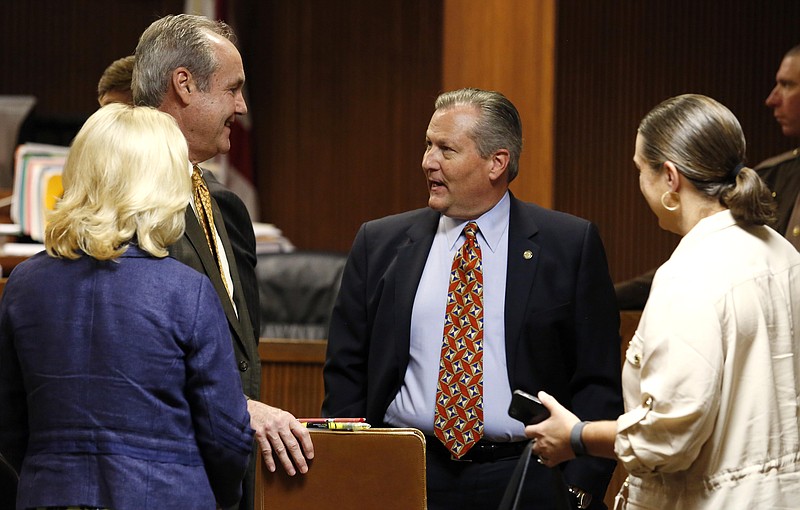 Mike Hubbard talks to attorney David McKnight before the afternoon session of jury selection on Tuesday, May 17, 2016 in Opelika, Ala. (Todd J. Van Emst/Opelika-Auburn News/Pool via AP)