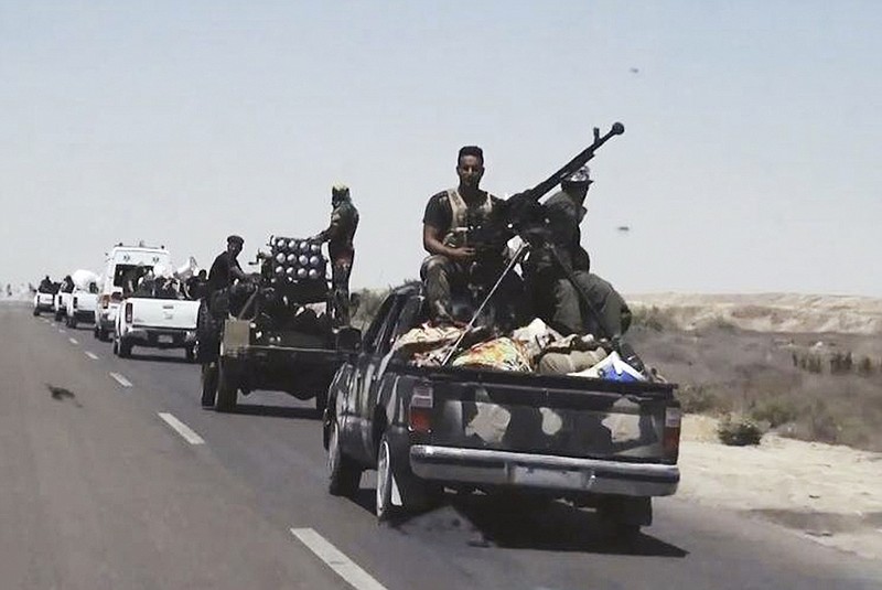 This July 13, 2015, file photo shows Iraqi security forces backed by Shiite and Sunni pro-government fighters preparing to attack Islamic State group positions in Fallujah, 40 miles (65 kilometers) west of Baghdad, Iraq. Iraqi Prime Minister Haider al-Abadi announced the beginning of military operations to retake the Islamic State-held held city of Fallujah, west of Baghdad in a televised address Sunday, May 22, 2016. Iraqi forces are "approaching a moment of great victory" against the Islamic State group, al-Abadi said surrounded by top military commanders from the ministry of defense and the country's elite counter terrorism forces. Fallujah has been under the control of IS for more than two years. (AP Photo, File)