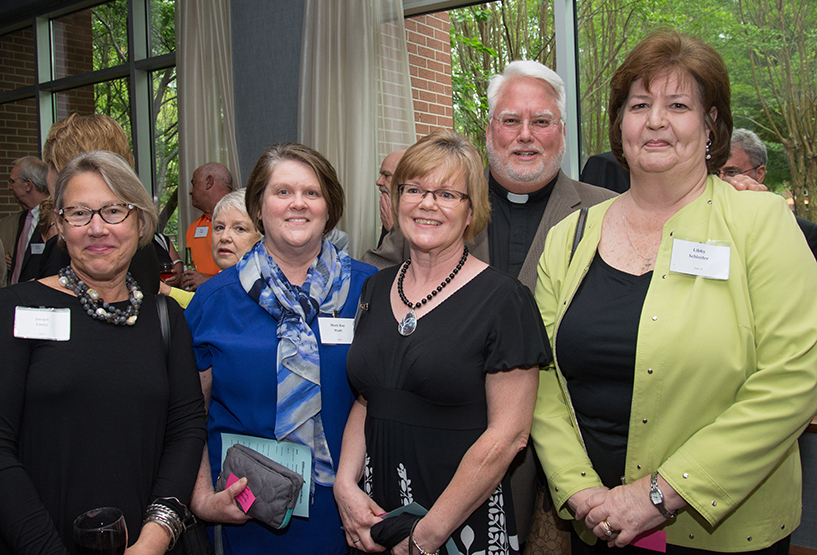 Jacqui Casey, Mary Kay Hiatt, Father Mike Nolan, Joanne Gentler and Libbey Schleifer