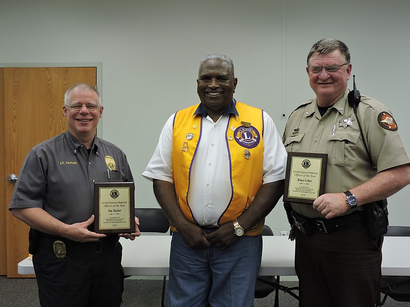 Chickamauga Police Department Detective Ira Taylor, Chickamauga Lions Club president Eddie UpShaw and Walker County Sheriff Deputy Bruce Coker, from left, stand together after the awards presentation.